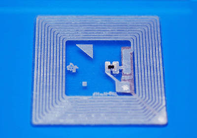 A RFID tracking tag is bonded with flexible conductive adhesive
